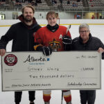 Ben Vandervies and Cathy Hosowich presenting the Alberta Junior Athletic Awards to Sydney White