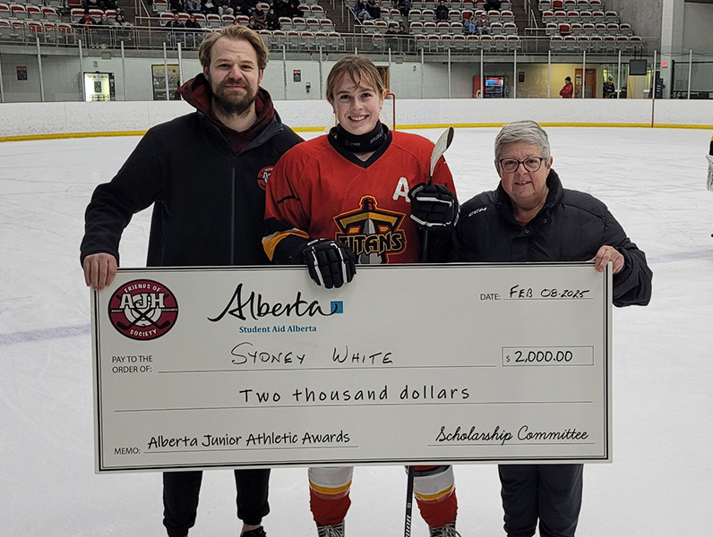 Ben Vandervies and Cathy Hosowich presenting the Alberta Junior Athletic Awards to Sydney White