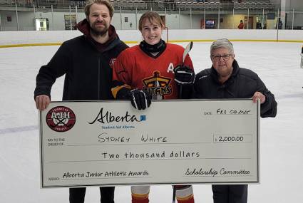 Ben Vandervies and Cathy Hosowich presenting the Alberta Junior Athletic Awards to Sydney White